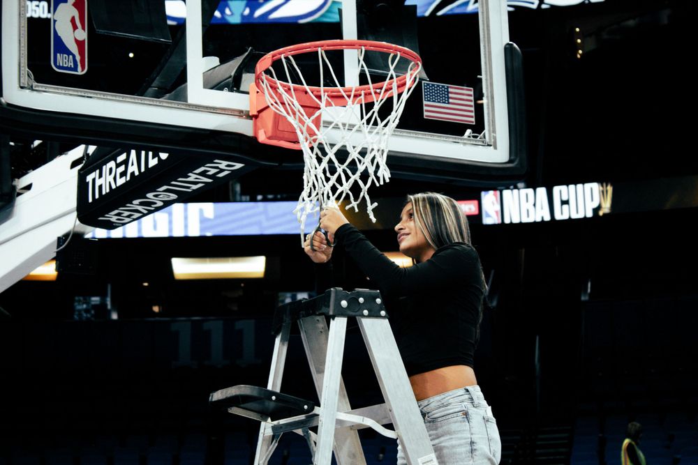 Multiple action shots of basketball players dunking at an NBA game in an arena setting.