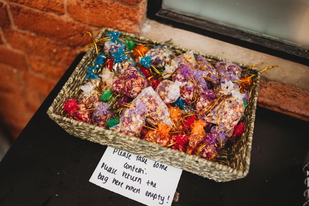 Colorful floral arrangements displayed with handwritten notes.