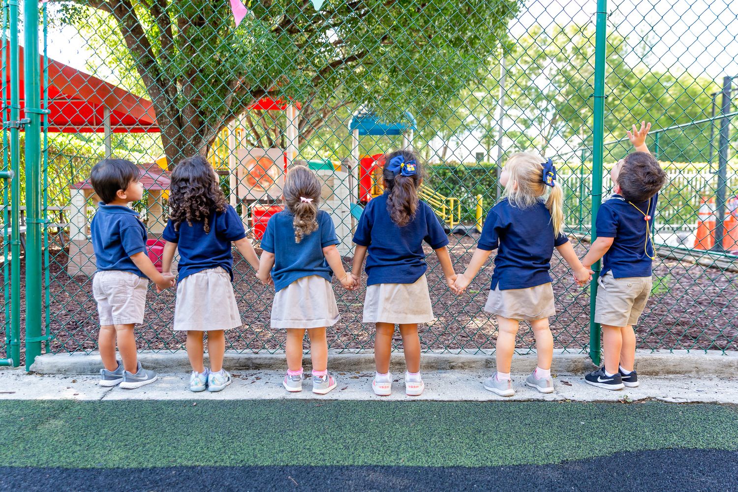 Students in uniforms, outdoor during school event.