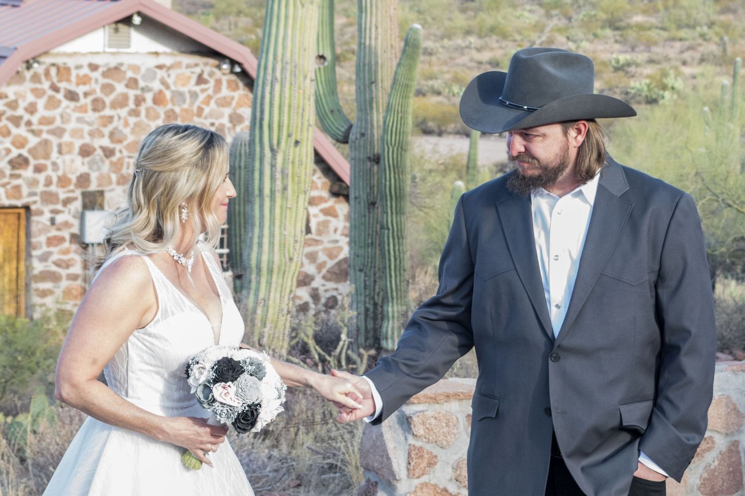 couple getting married in rural Marana, Arizona at Sanctuary Cover beneath Safford Peak