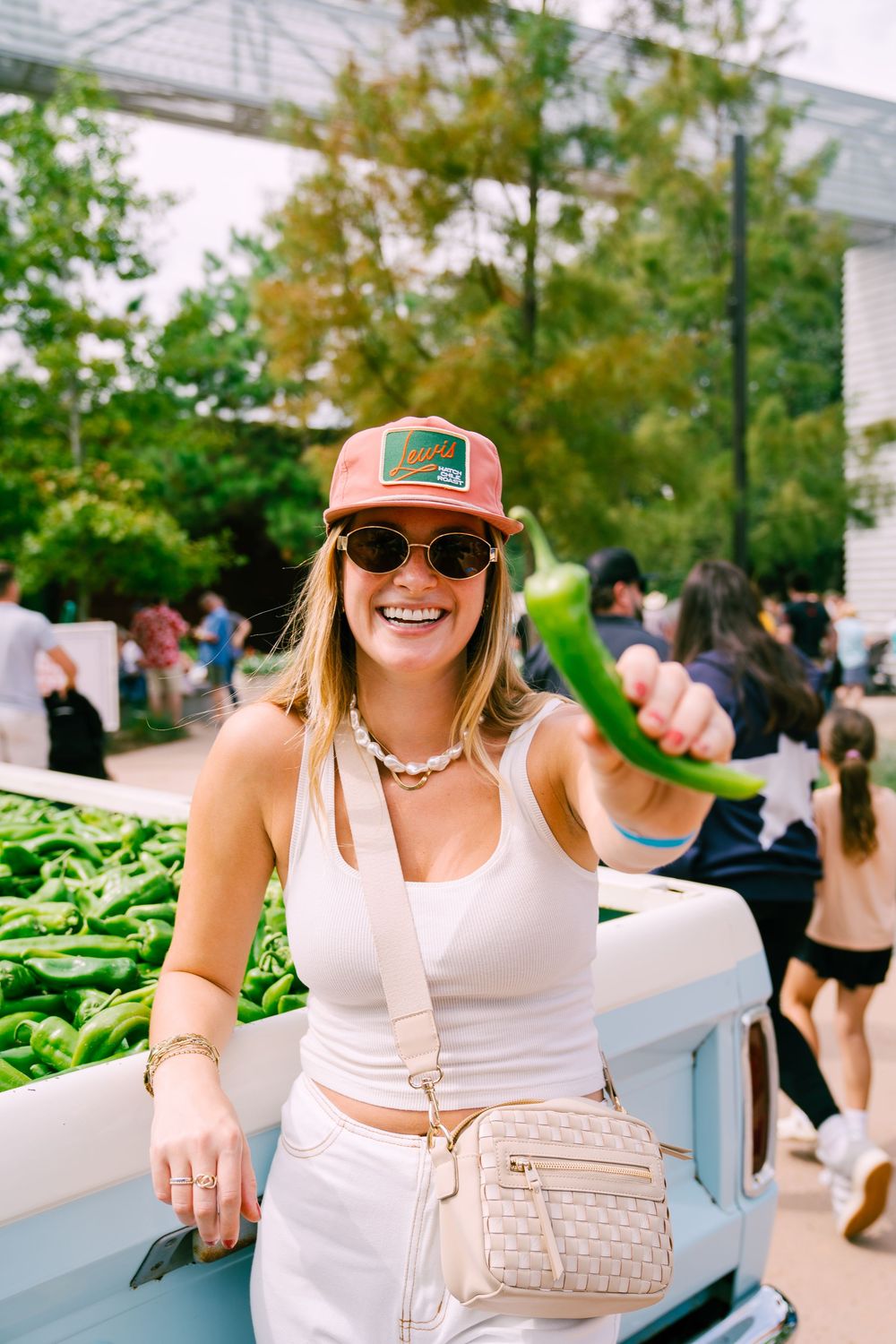 Casual summer festival scene with fresh produce displays and attendees enjoying the atmosphere.