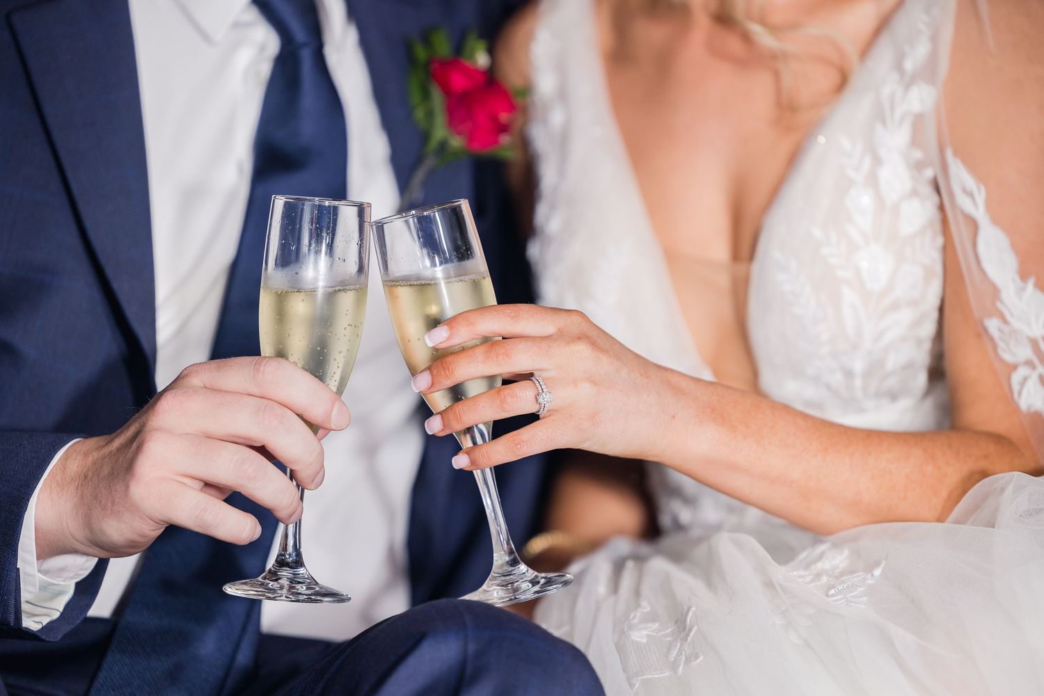 Close-up details of champagne toasts and celebrations at an elegant wedding reception.