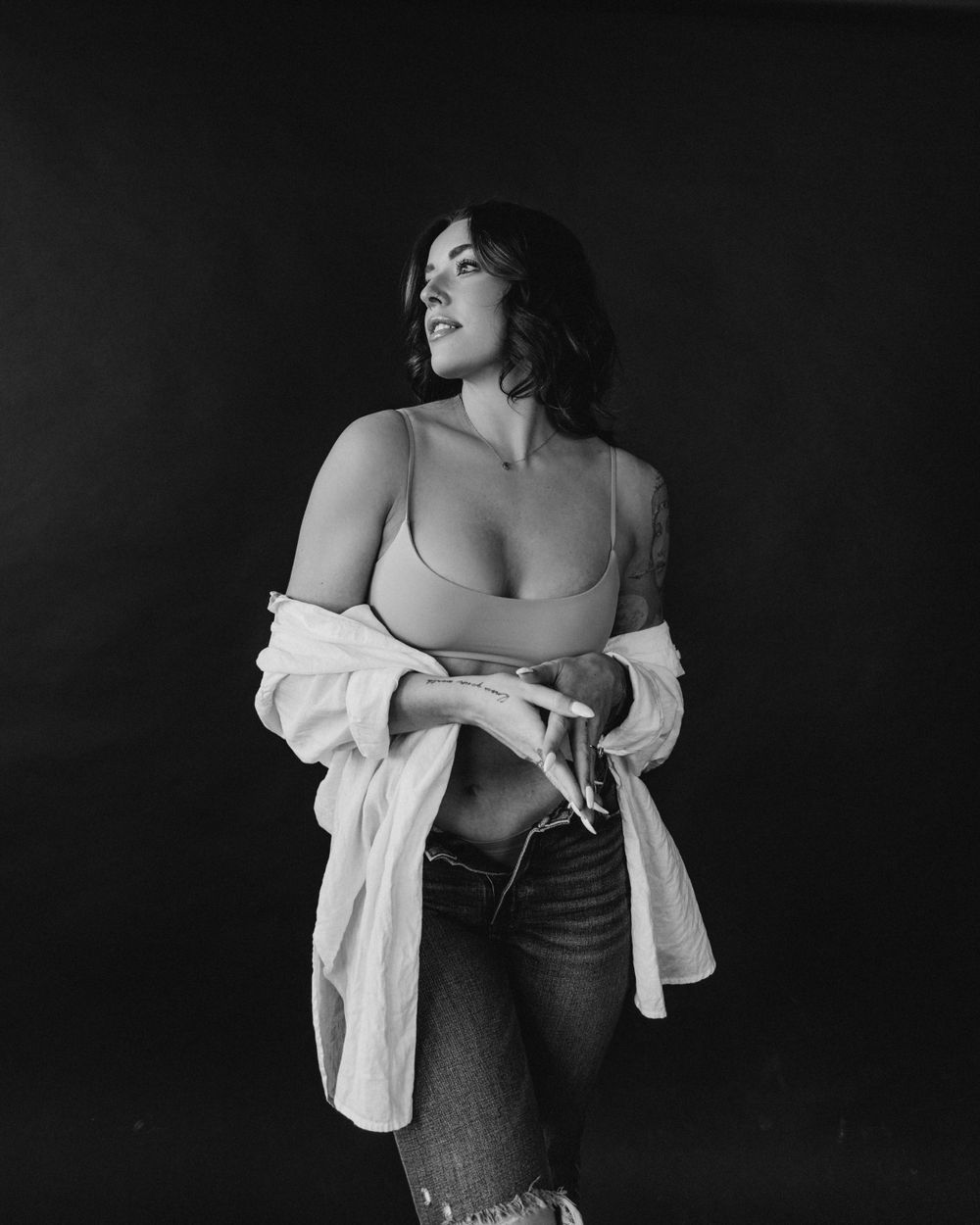 Dramatic black and white portrait highlighting casual fashion styling.