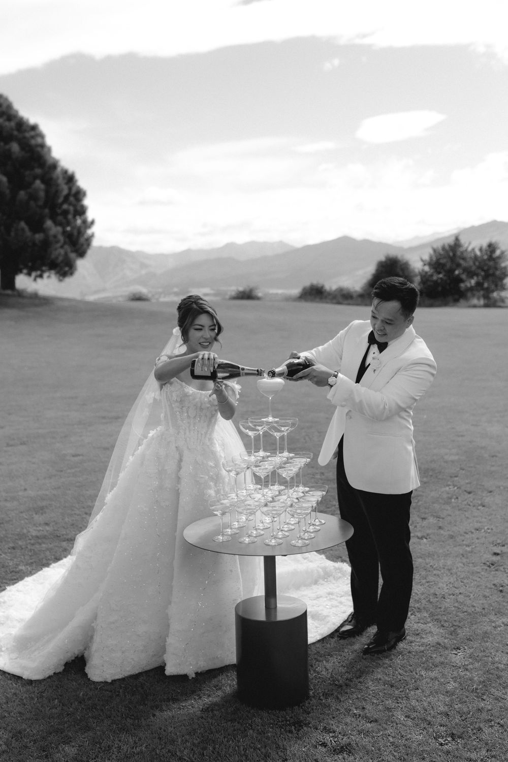 Bride and groom celebrating together after outdoor wedding ceremony