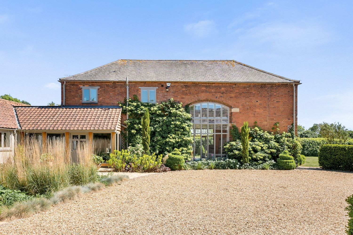 Drone image capturing the externals of a large countryside property for a real estate property listing.
