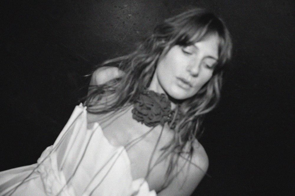 Black and white photo series showing dramatic poses and expressions in an artistic portrait session.