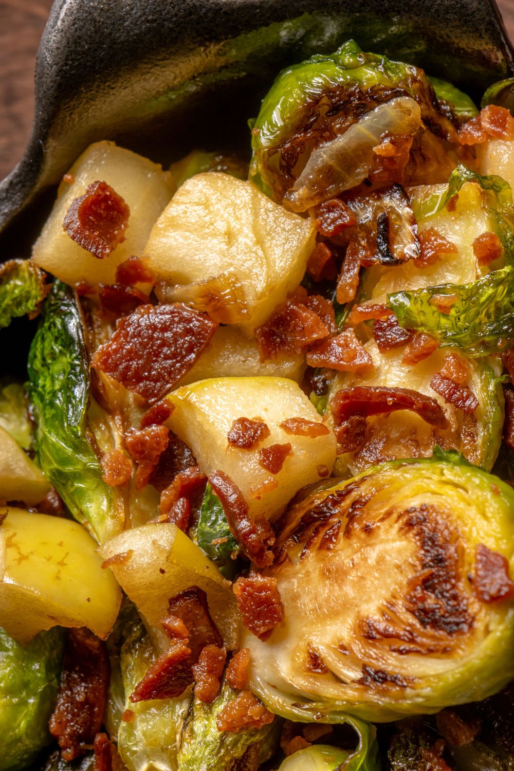 Roasted Brussels sprouts and potatoes with crispy bacon bits in a cast iron skillet. By NJ Photographer Andrew Fein