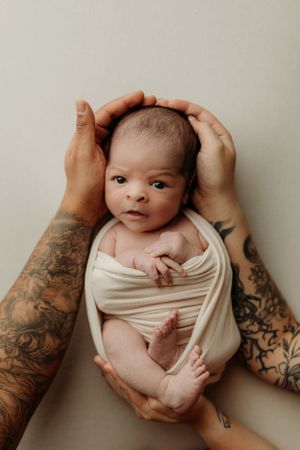 tattooed mom and dad and baby photo