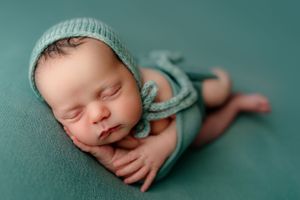 kettering newborn wrapped in teal
