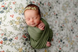 colorful Dayton newborn wrapped in green