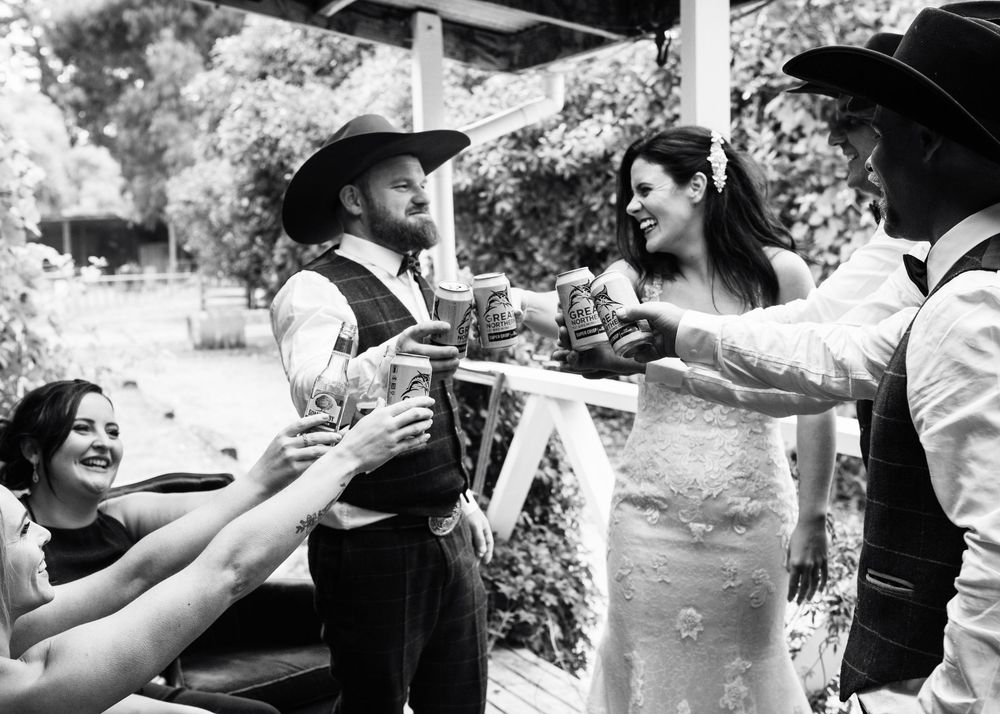 People enjoying beverages and toasting at an outdoor celebration party gathering.