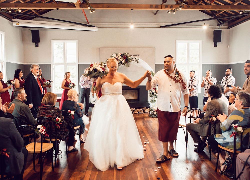A panoramic sequence showing a lively wedding reception scene with dancing and celebrations in a rustic wooden venue.