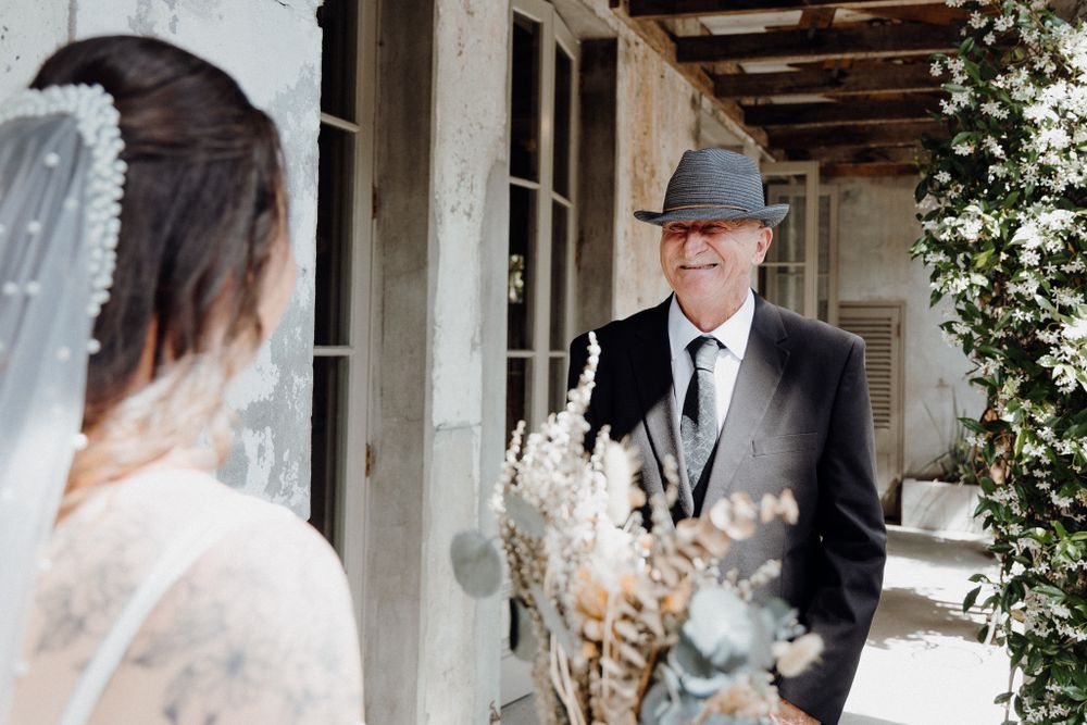 Emotional moment during the First Look between the bride and her father, captured by Apertured Media Auckland Wedding Photographer.