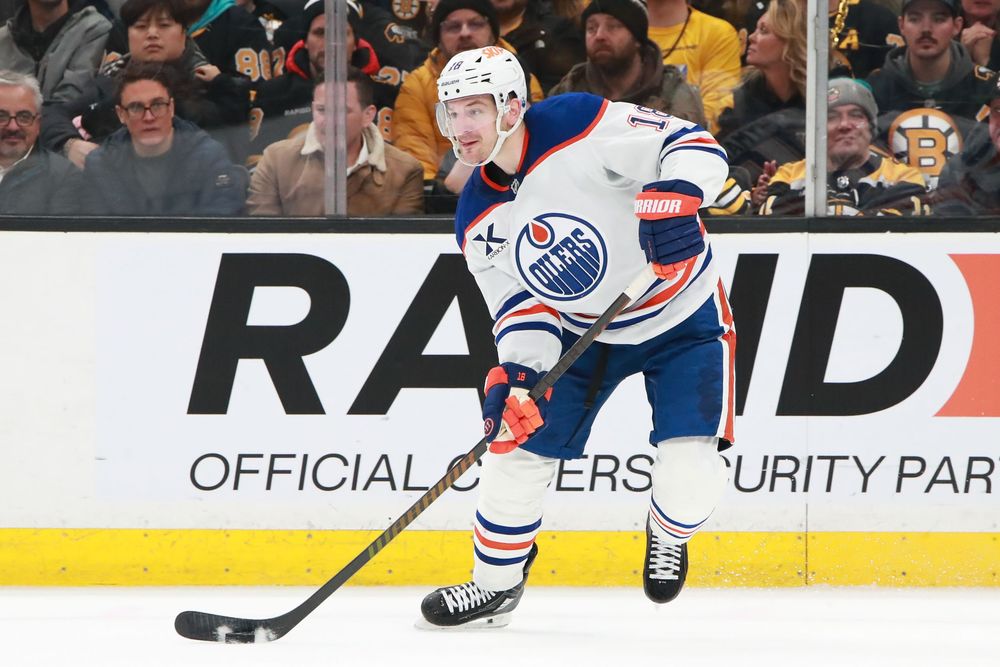 NHL players compete for position during a professional hockey game.