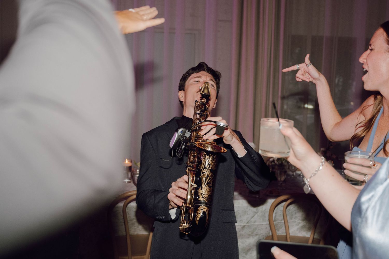 A series of energetic performance shots showing musicians and performers on stage during a live concert.