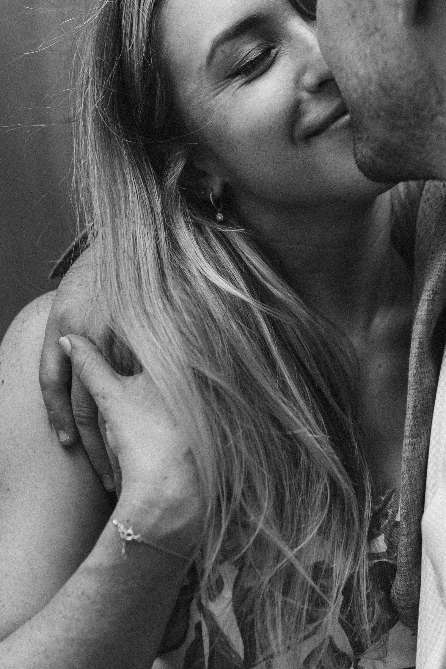 Black and white intimate portraits showing gentle expressions and closeness.