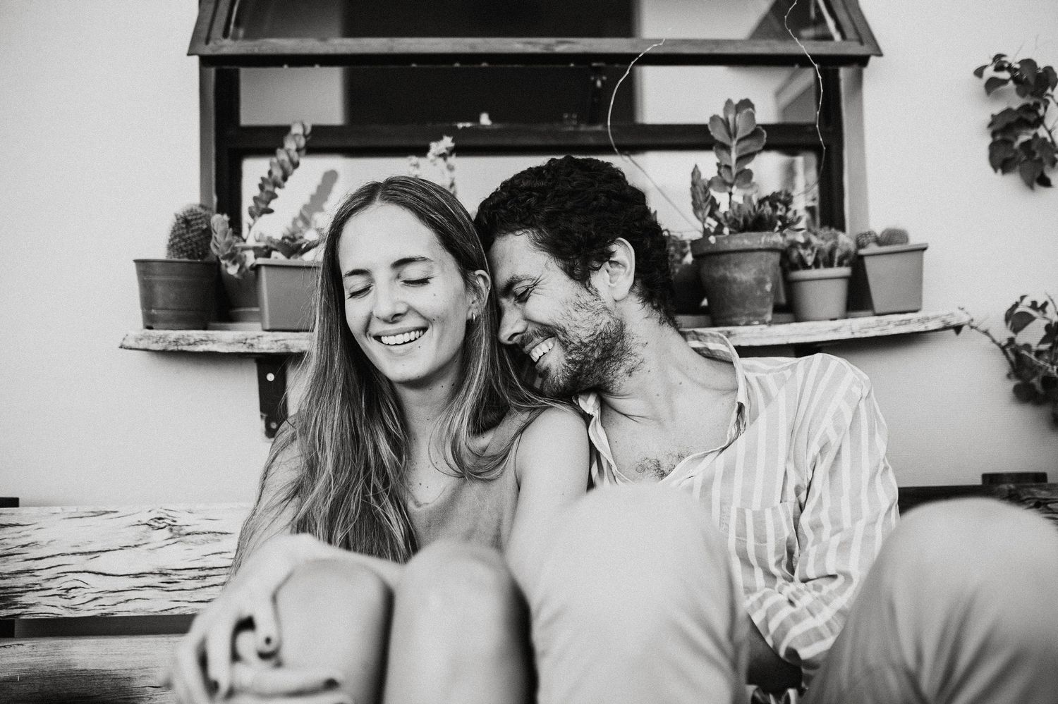Romantic black and white close-up photo of couple sharing an intimate moment together.