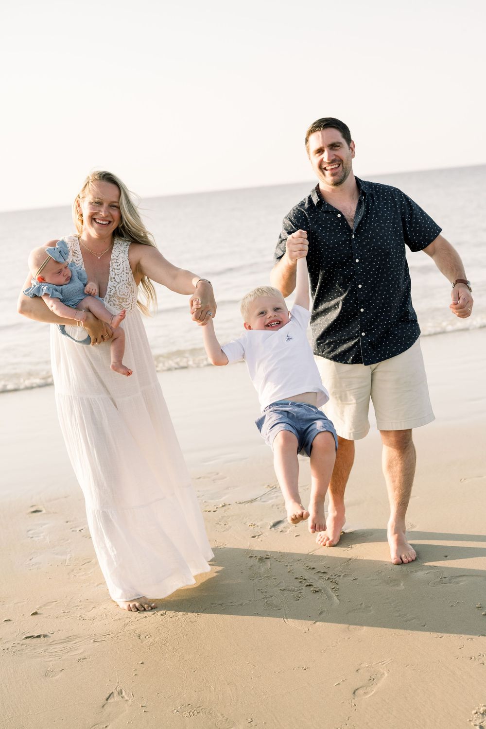 A family plays together on a sunny beach, creating joyful moments in a sequence of candid shots.