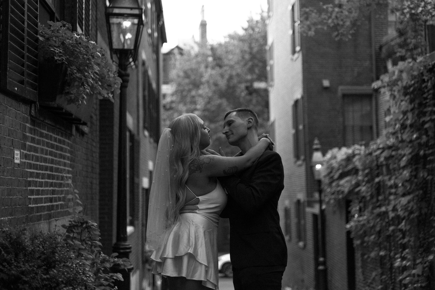 A series of black and white street photography images arranged in a horizontal strip showing urban scenes and architecture.