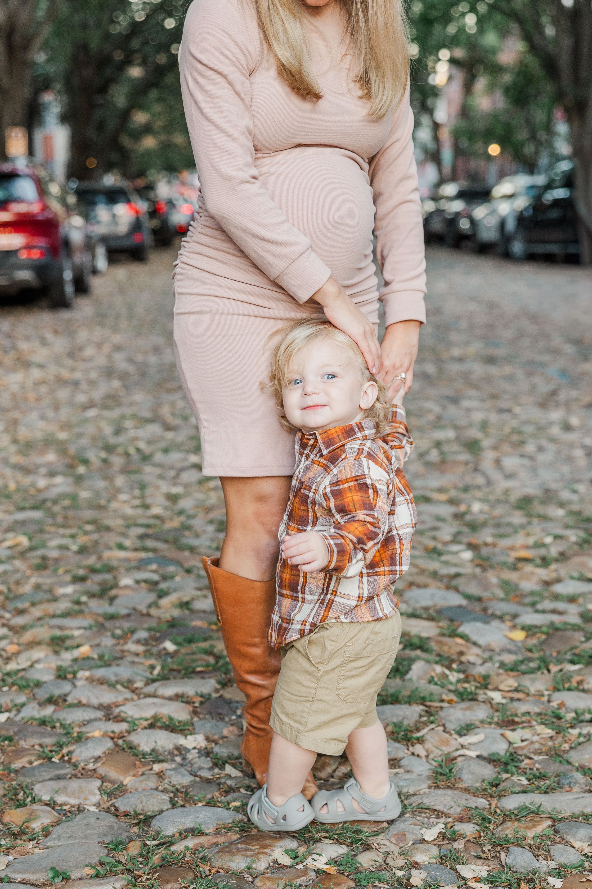 Autumn family photo showing coordinated casual outfits and boots.
