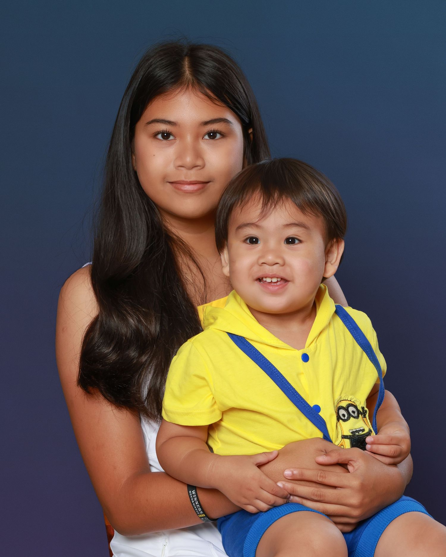 Family studio portrait with soft lighting and neutral backdrop in Miramichi