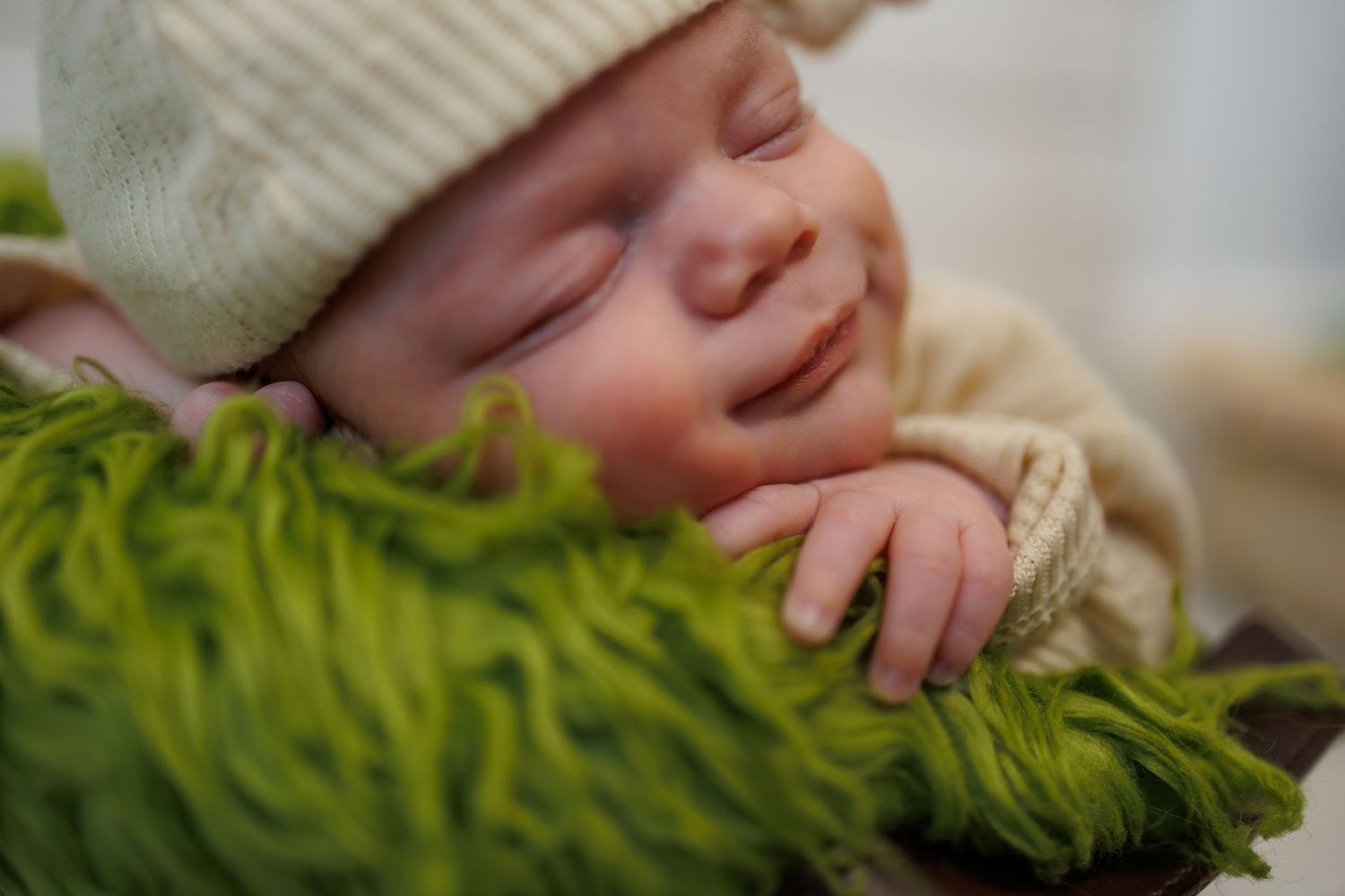 Close up detail of newborn baby during a twin newborn photography session in Michigan