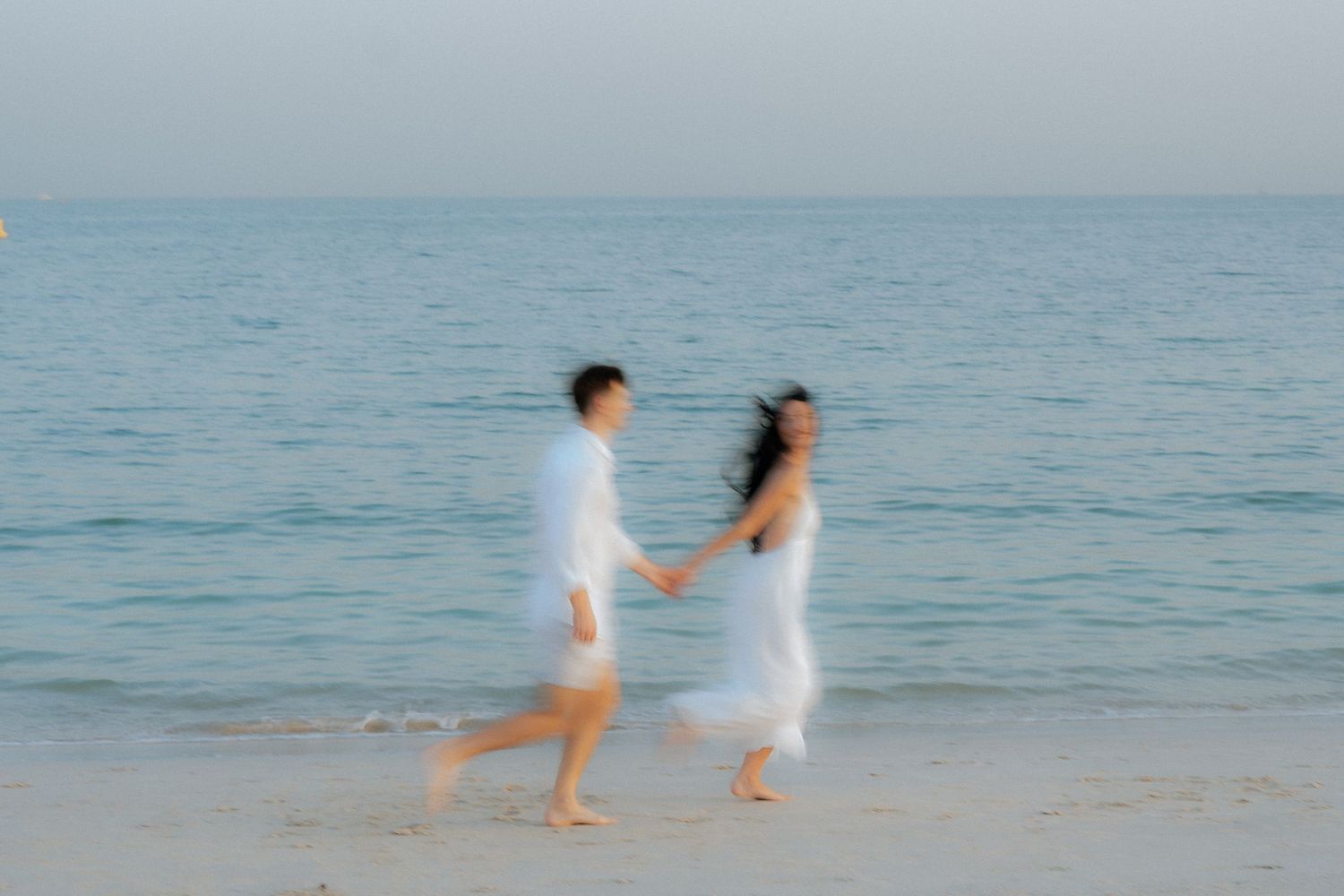 Joyful beach couple moment with natural light in Dubai