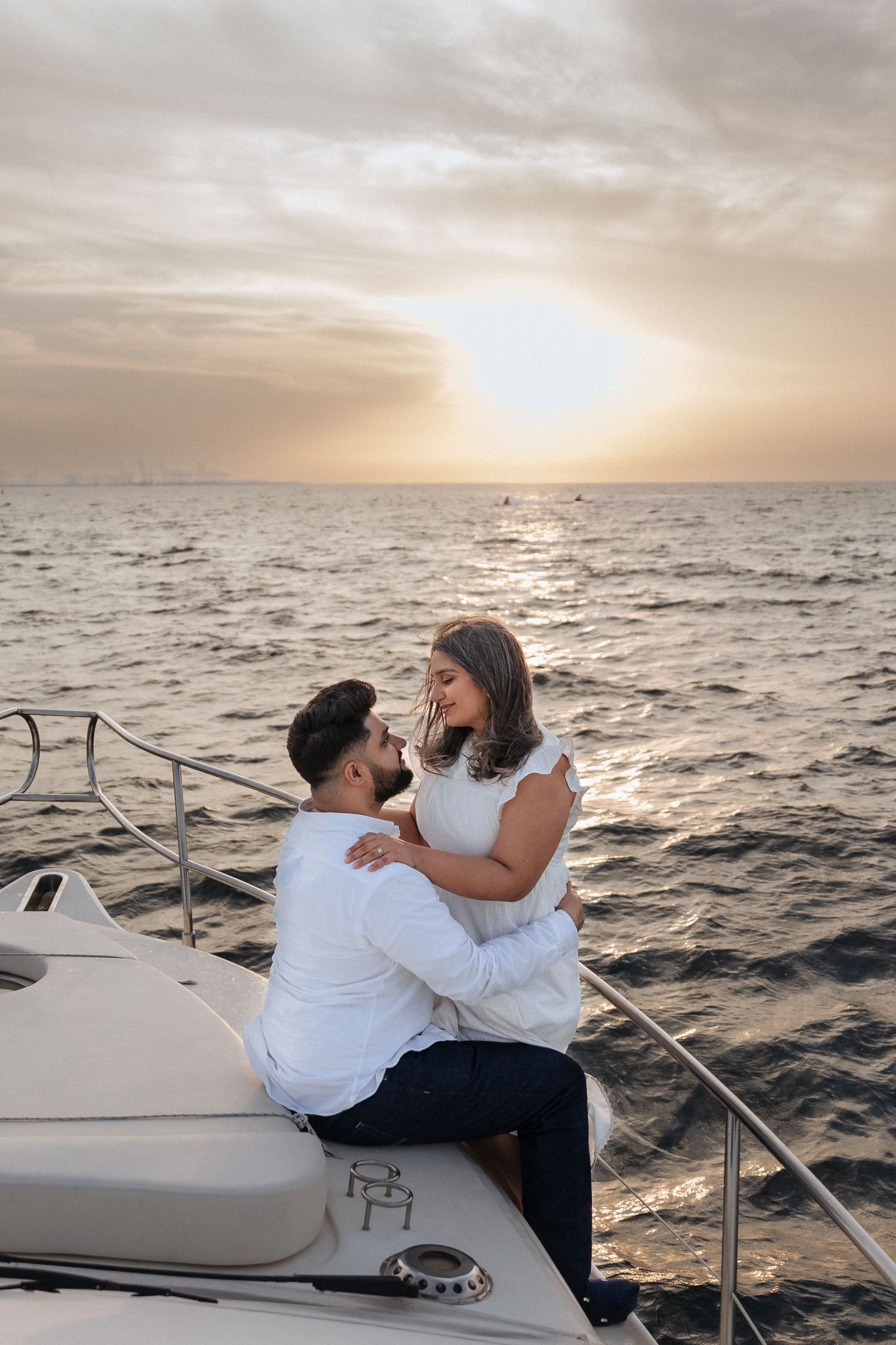 Couple engagement session on yacht in Dubai with ocean backdrop
