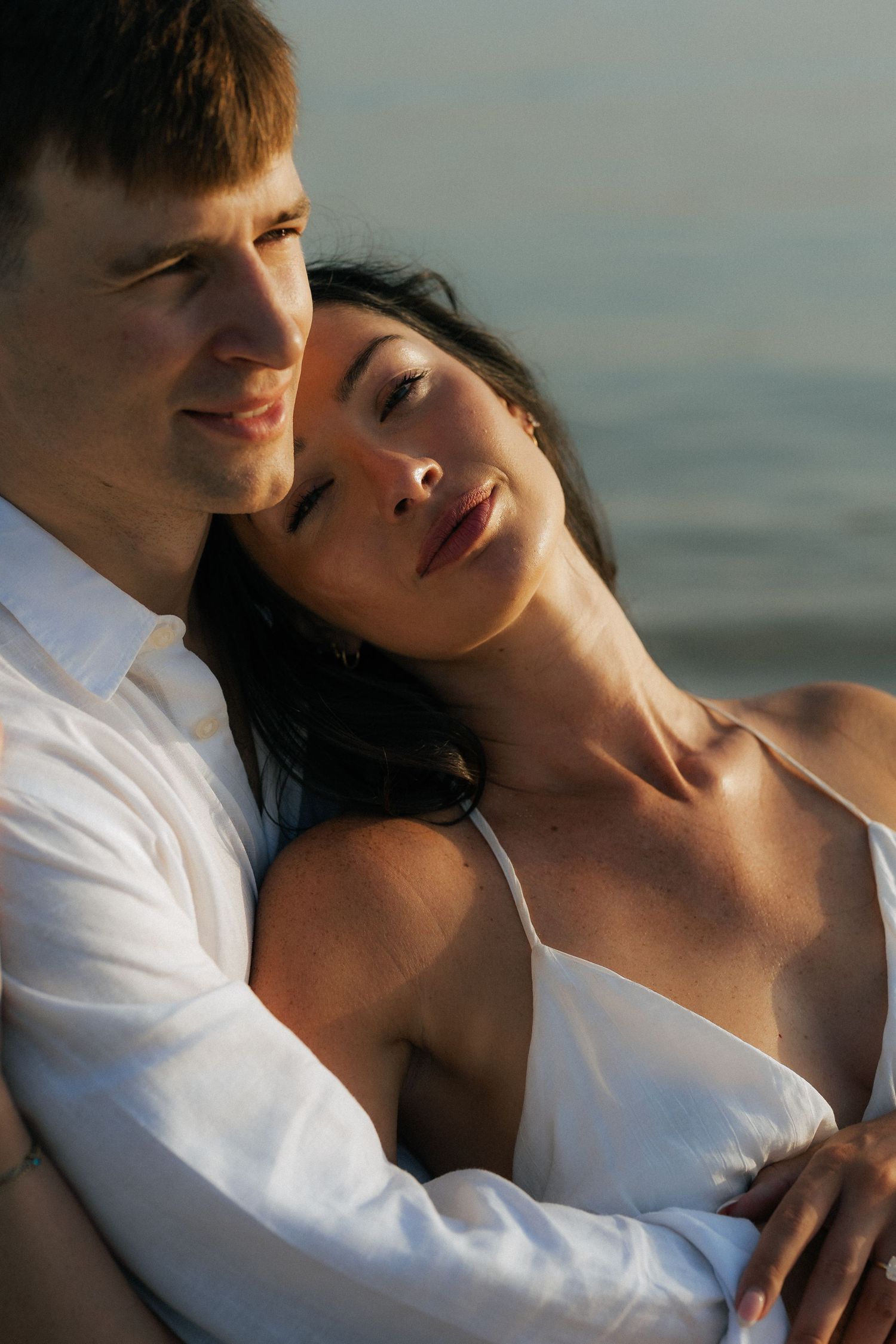 Close-up romantic couple portrait with warm sunset tones