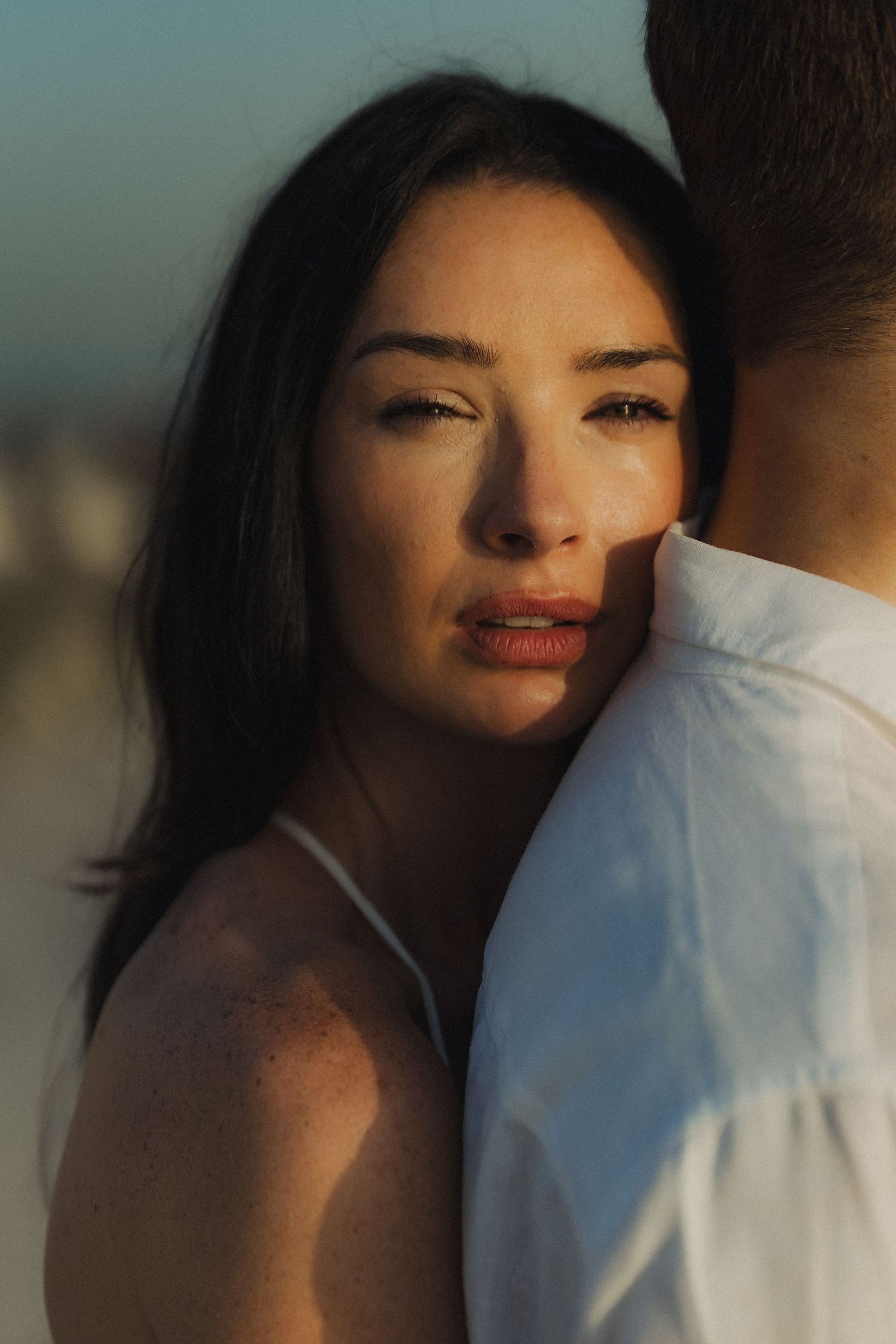 Romantic beach couple photoshoot in Dubai with couple standing in the sea