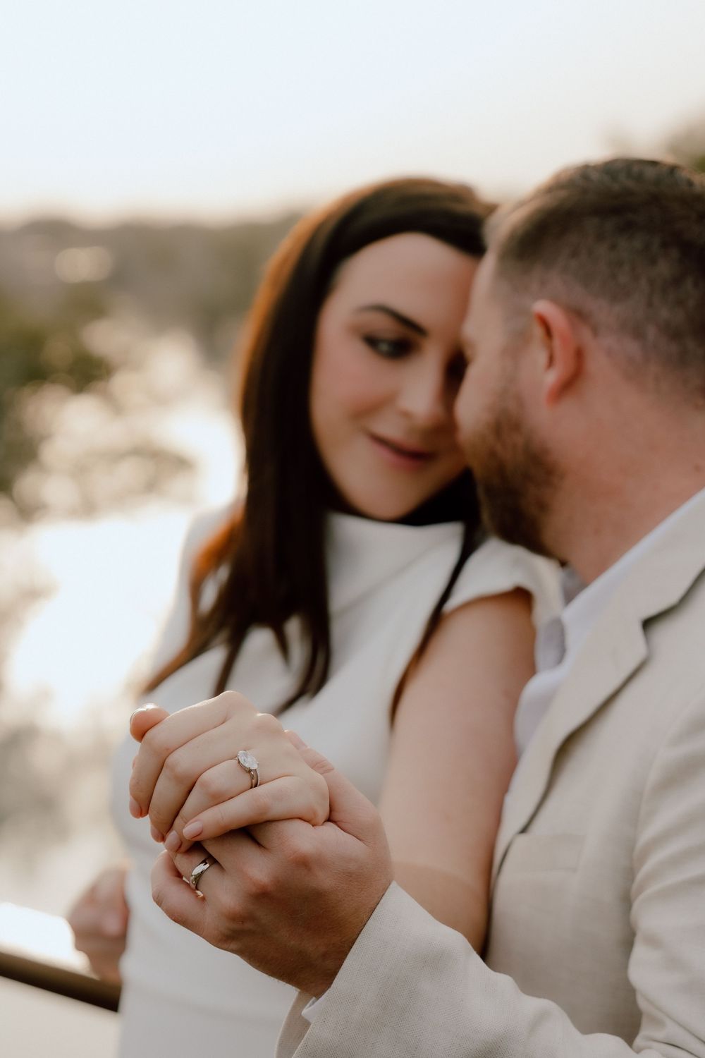 Intimate wedding portrait of bride and groom sharing a quiet moment at sunset