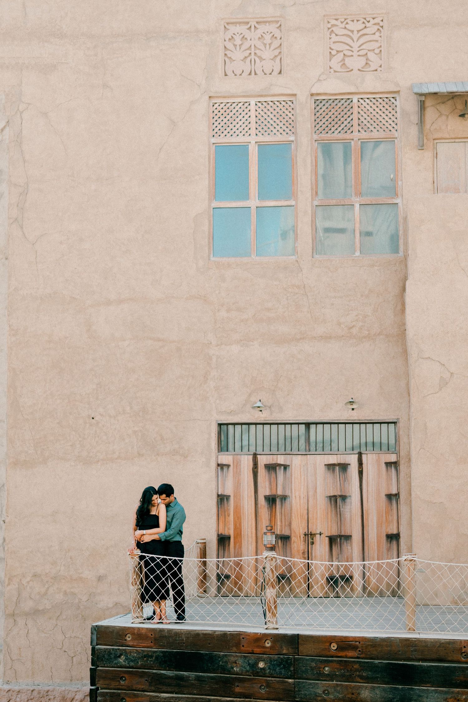 Candid couple portrait in historic Dubai architecture setting