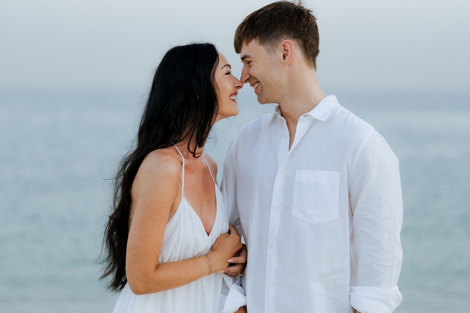 Intimate seaside couple session in Dubai with ocean backdrop