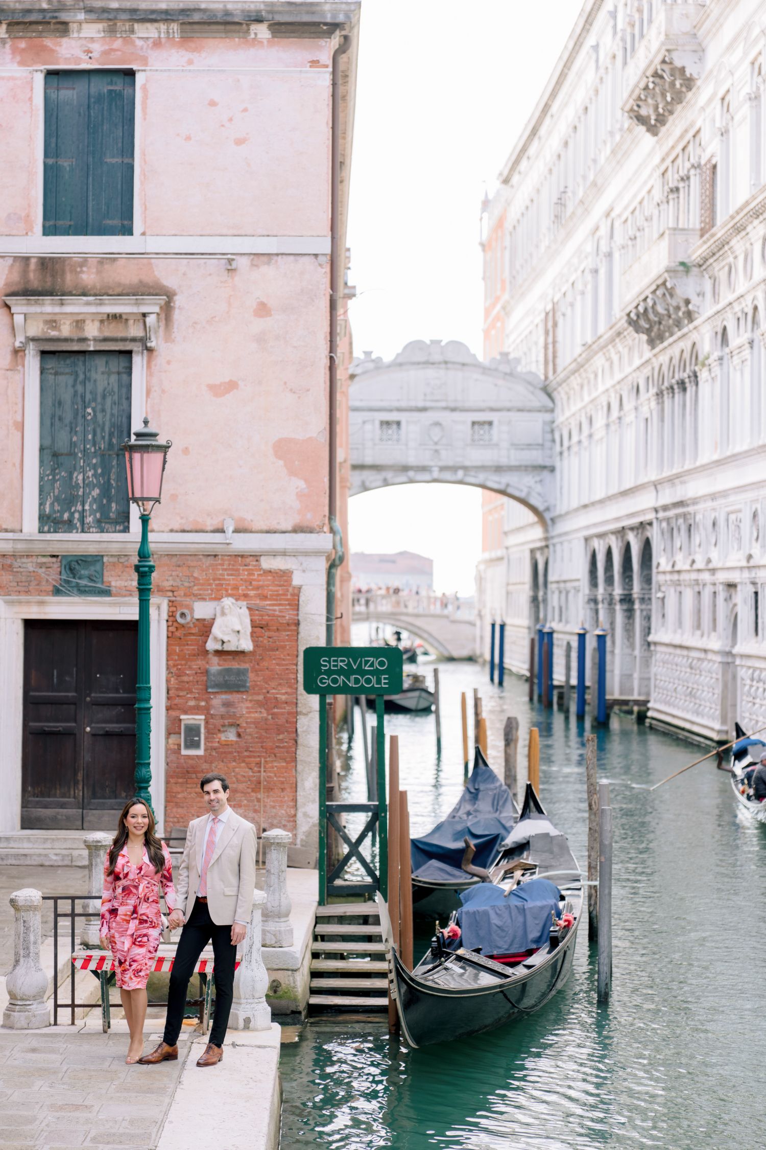 Romantic gondola ride through Venice's flooded canals with ornate historic buildings and architecture in the background.