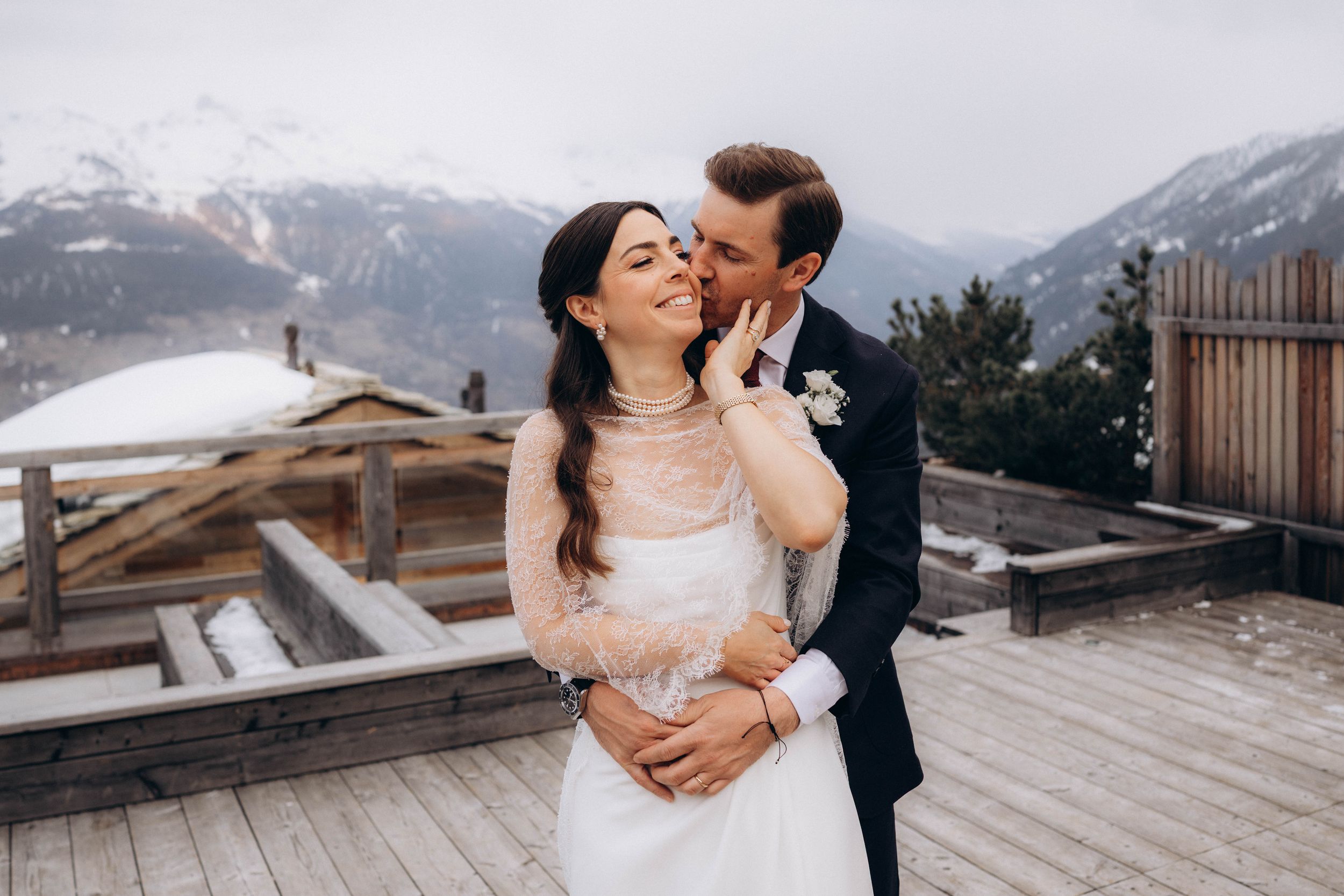 A romantic dance silhouette under stone archways with warm lighting.