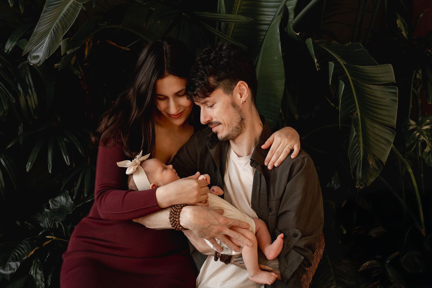 Parents holding newborn baby Vancouver lifestyle newborn photography