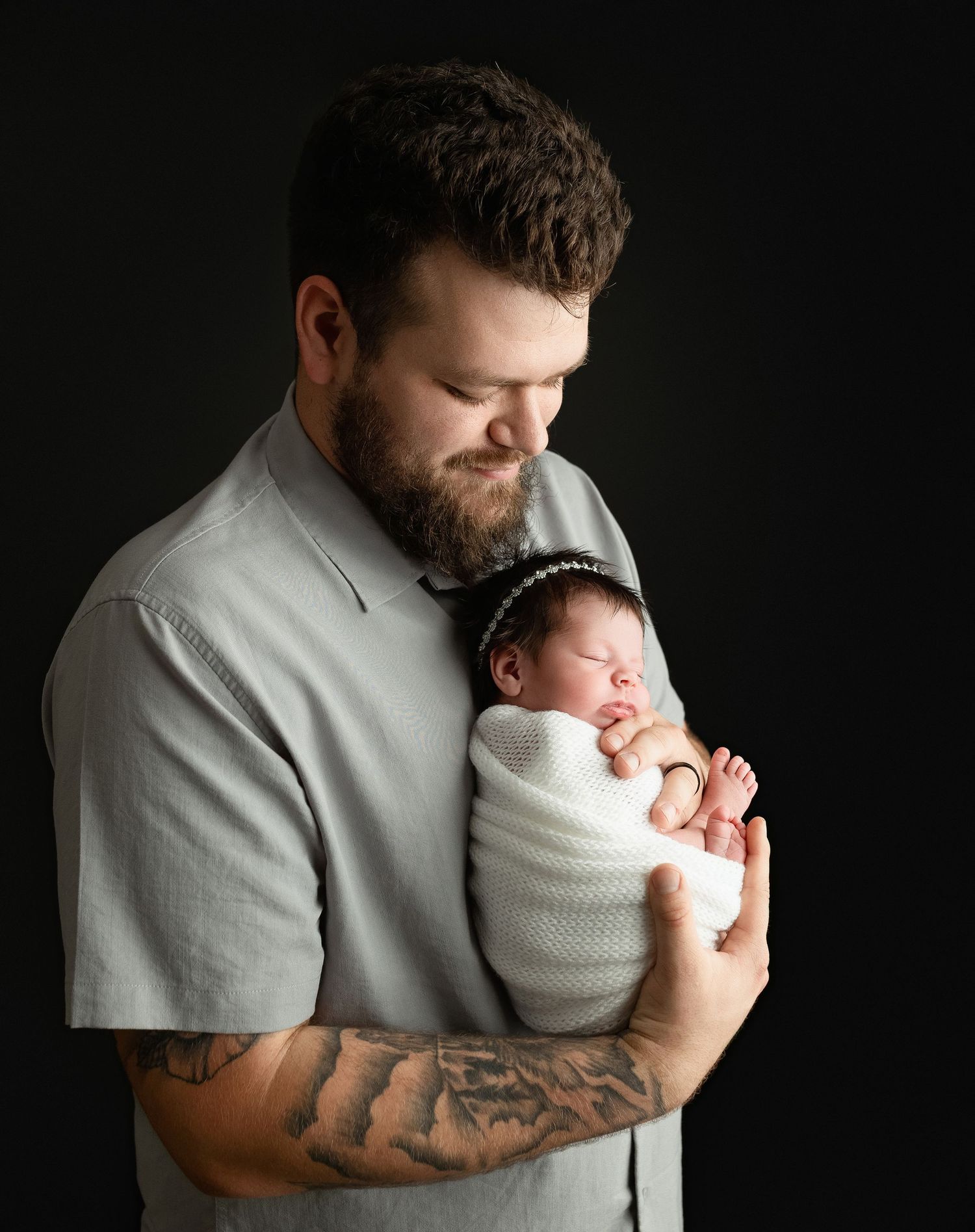A father holding his newborn girl. Greenville, SC newborn photographer, Easley, SC newborn photographer, Upstate, SC newborn photographer.
