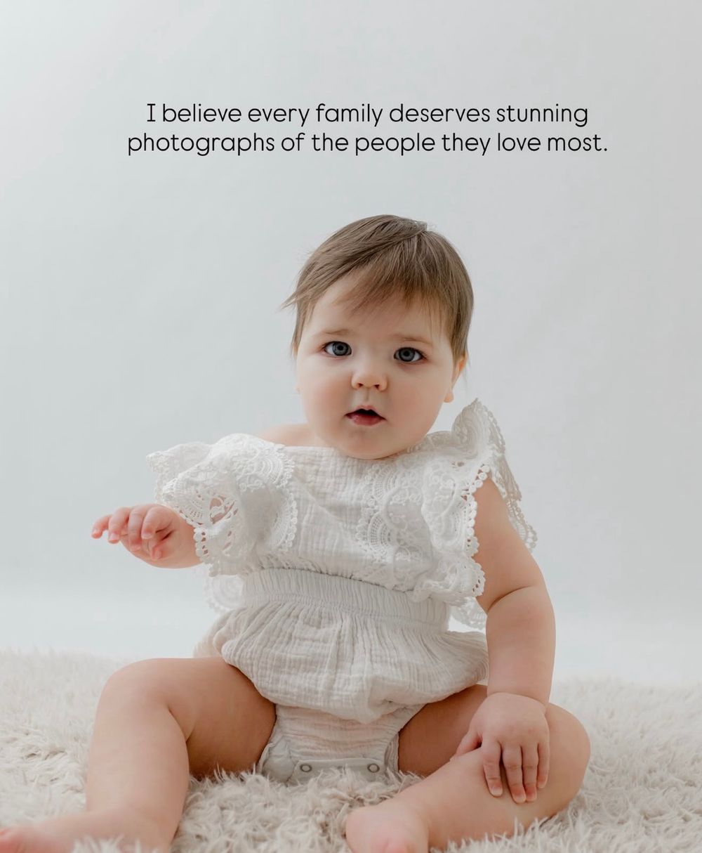 Baby wearing vintage-style white dress on soft carpet with text about family photography.