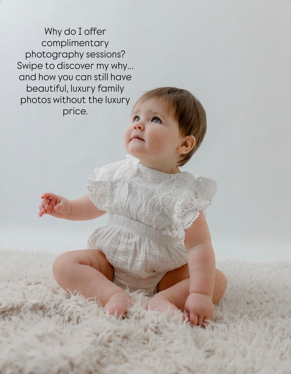 Baby in white lace dress sitting on plush carpet looking up with text overlay about complimentary photography session.
