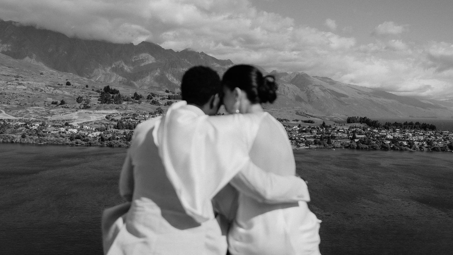 A black and white panoramic wedding photo series showing a couple with scenic Queenstown mountain landscapes.