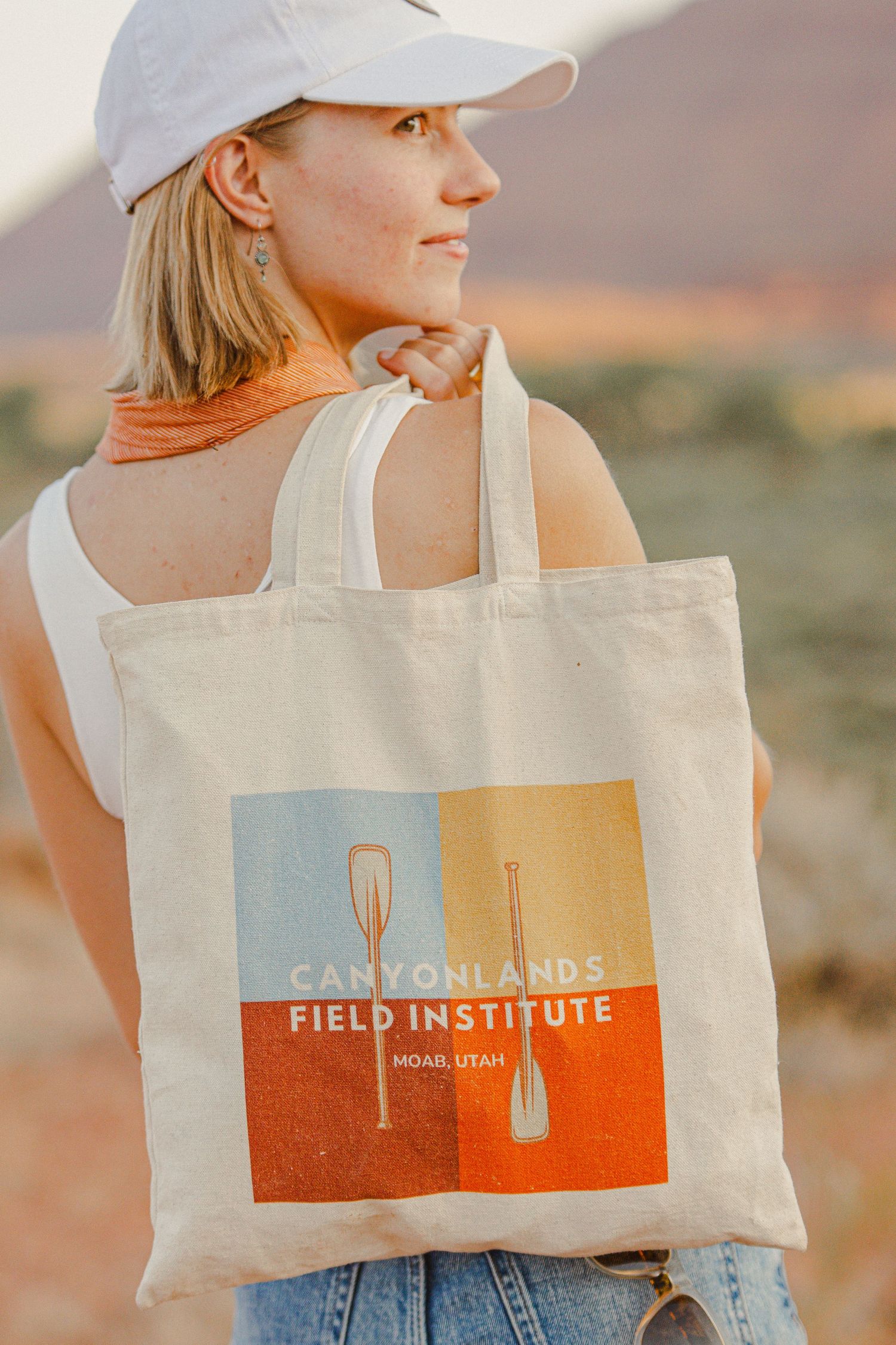 Canvas tote bag displaying Canyonlands Field Institute logo against desert scenery.