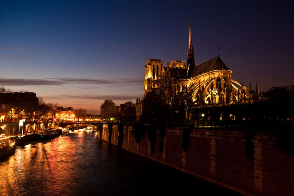 Notre Dame Cathedral at twilight from a bride over the River Seine
