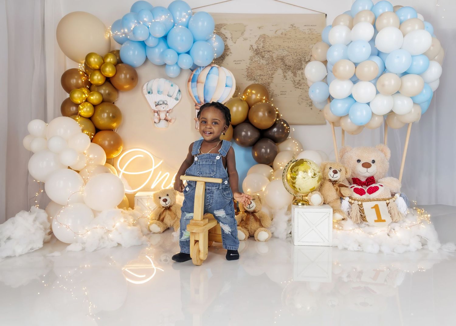 luxury smash cake photoshoot teddy bear themed first birthday setup with blue and gold balloons in Worcester Massachusetts