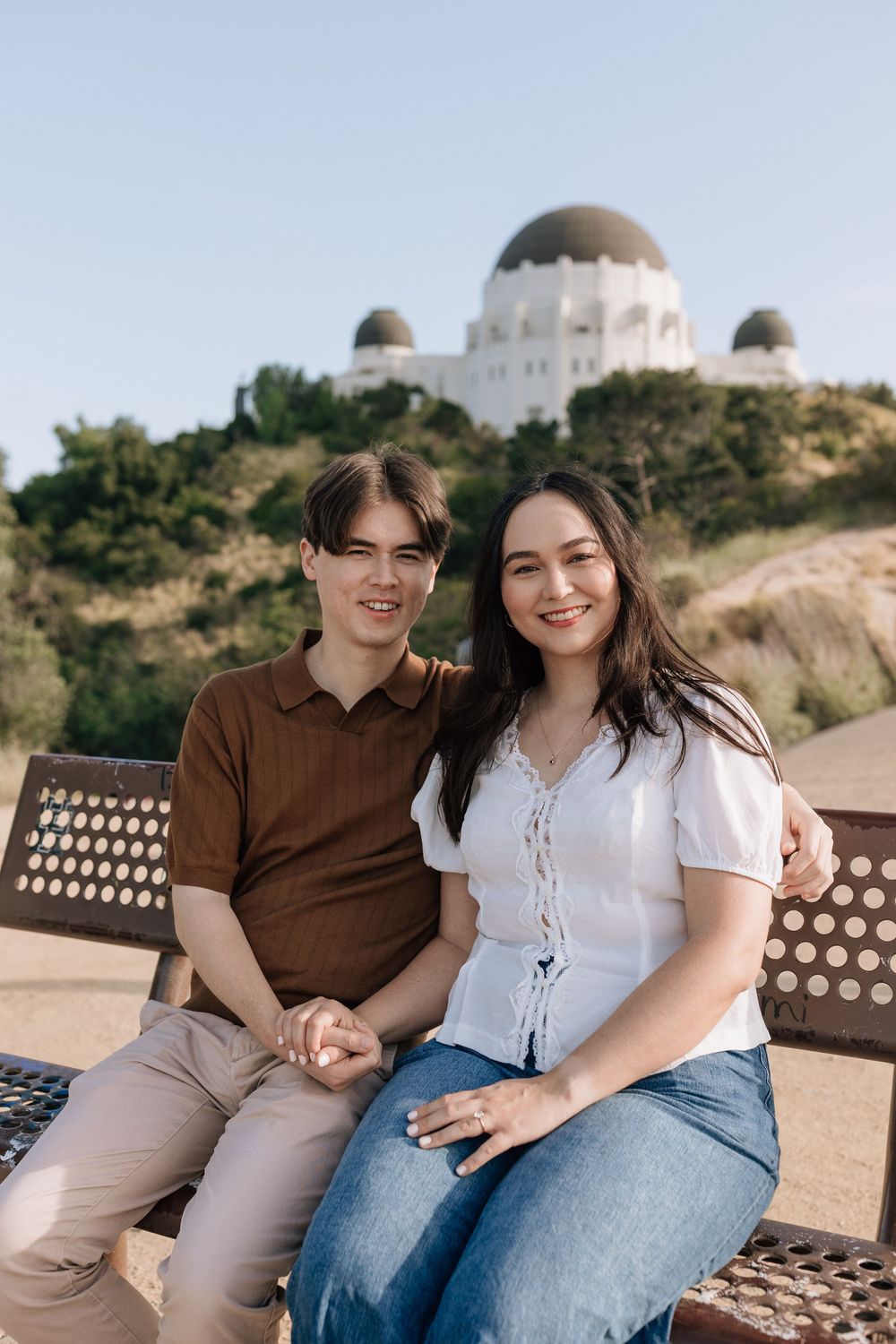 Raw and unposed engagement moments at Griffith Observatory, photographed on 35mm film by a Southeast NC documentary photographer.