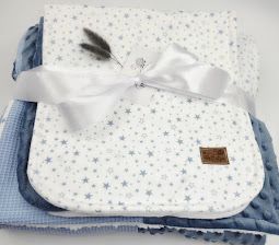 Blue and white star-patterned baby blanket set tied with a white satin ribbon bow, featuring gingham fabric layers.