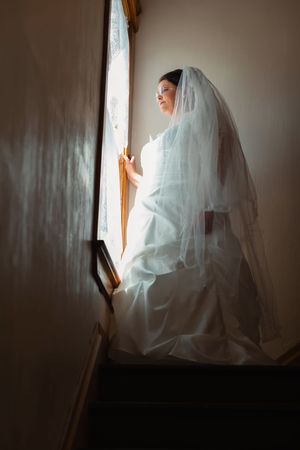 Hidden Gem wedding Meridian Idaho bride looking out window