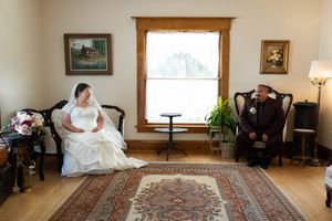 Hidden Gem wedding Meridian Idaho couple sitting in chairs inside house
