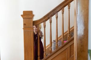 Hidden Gem wedding Meridian Idaho child peeking through staircase