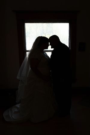Hidden Gem wedding Meridian Idaho bride and groom silhouette in front of window