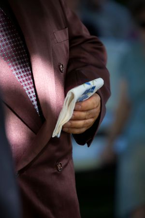 Hidden Gem wedding Meridian Idaho groom holding heirloom handkerchief